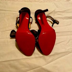 Black open toe with soft bow.  Professional renewed.